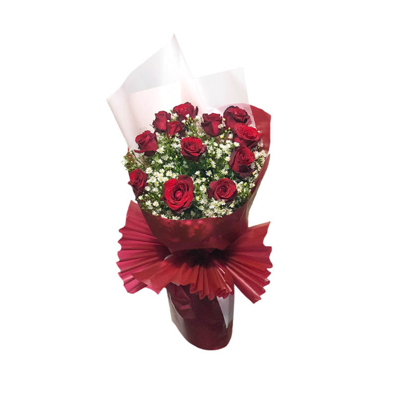 Country Dreams Bouquet: Capture the essence of pure romance with a dozen exquisite red Baguio roses and delicate aster, wrapped in maroon and white Korean film. A charming bouquet that evokes rustic beauty. Flower delivery in San Pedro, Laguna.