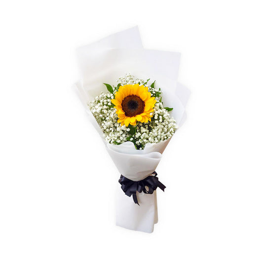 Captivating sunflower: A single sunflower embraced by delicate Gypsophila fillers, wrapped in a Korean style with a satin ribbon, exuding natural beauty. Perfect for delivery to Ayala Malls The 30th and Power Plant Mall.