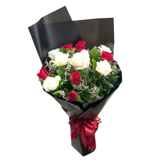 Captivating Bouquet of Red and White Roses with Misty Blue Fillers in Korean-style wrap with satin ribbon - elegant flower arrangement for special occasions - flower delivery to SM City Calamba and Robinsons Place Los Baños