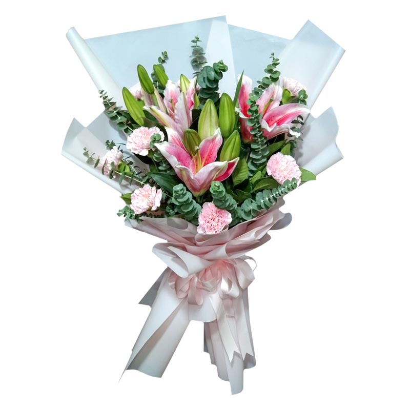 Stunning bouquet featuring three beautiful stargazer lilies and a dozen vibrant carnations, complemented by fresh eucalyptus leaves. Expertly wrapped in a Korean-style wrap and adorned with a satin ribbon. Celebrate any occasion with this enchanting bouquet. Flower delivery in Cainta, Rizal.