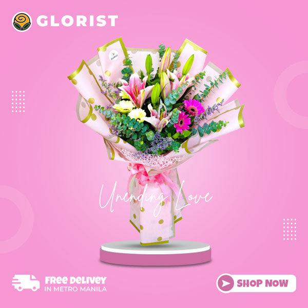Exquisite bouquet: Stargazer lilies, vibrant gerbera daisies, eucalyptus leaves, misty blue fillers. Korean-style wrap with satin ribbon and net embellishment