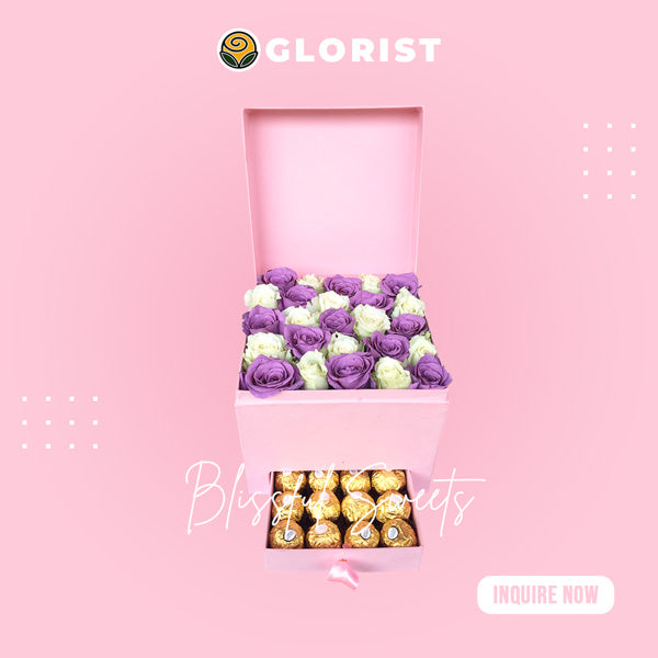 Elegant box filled with white roses and painted purple roses, accompanied by Ferrero Rocher chocolates. Perfect for special occasions. Flower delivery near Rizal Park, Greenbelt, Glorietta, and Ayala Triangle Gardens.