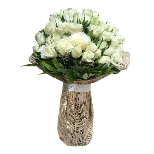 Beautiful vase filled with 36 white roses and delicate misty blue fillers, creating an elegant and enchanting floral arrangement. Perfect for special occasions. Flower delivery near Rizal Park, Greenbelt, Sky Ranch, and Antipolo Cathedral.