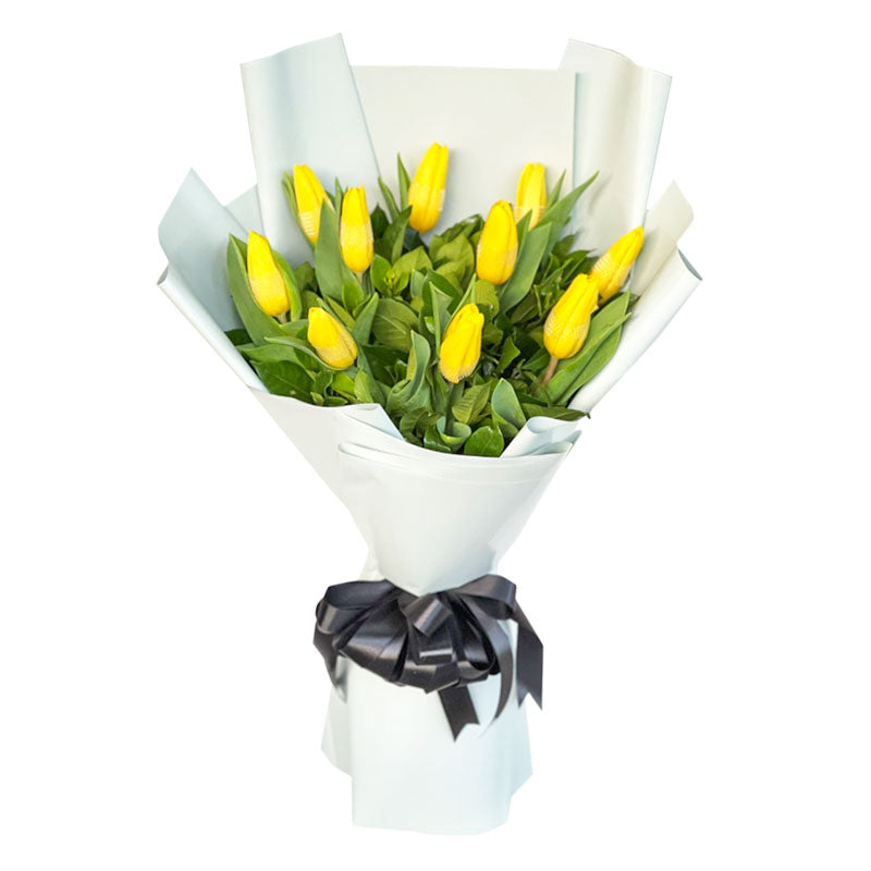 Radiant bouquet: ten yellow tulips in Korean-style wrap with satin ribbon - vibrant burst of sunshine and joy - flower delivery to Barangay Alabang, Muntinlupa City and Barangay BF Homes, Parañaque City