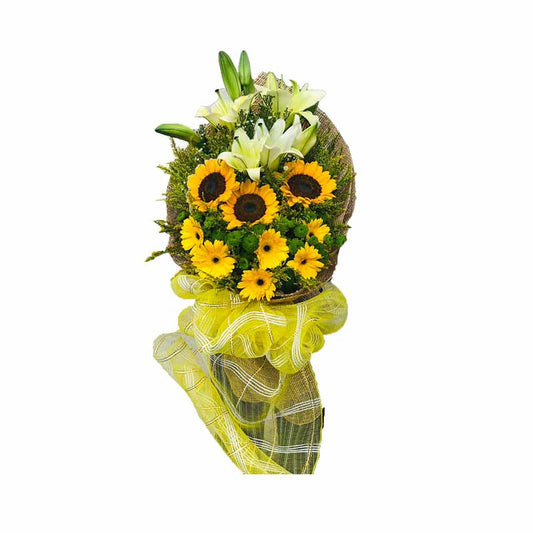 Breathtaking bouquet: Sunflowers, Stargazers, Gerberas adorned with Golden Rod and Green Buttons, wrapped in rustic burlap and net, radiating natural charm. Perfect for any occasion, this stunning arrangement is available for delivery to Art in Island and Shangri-La Plaza.