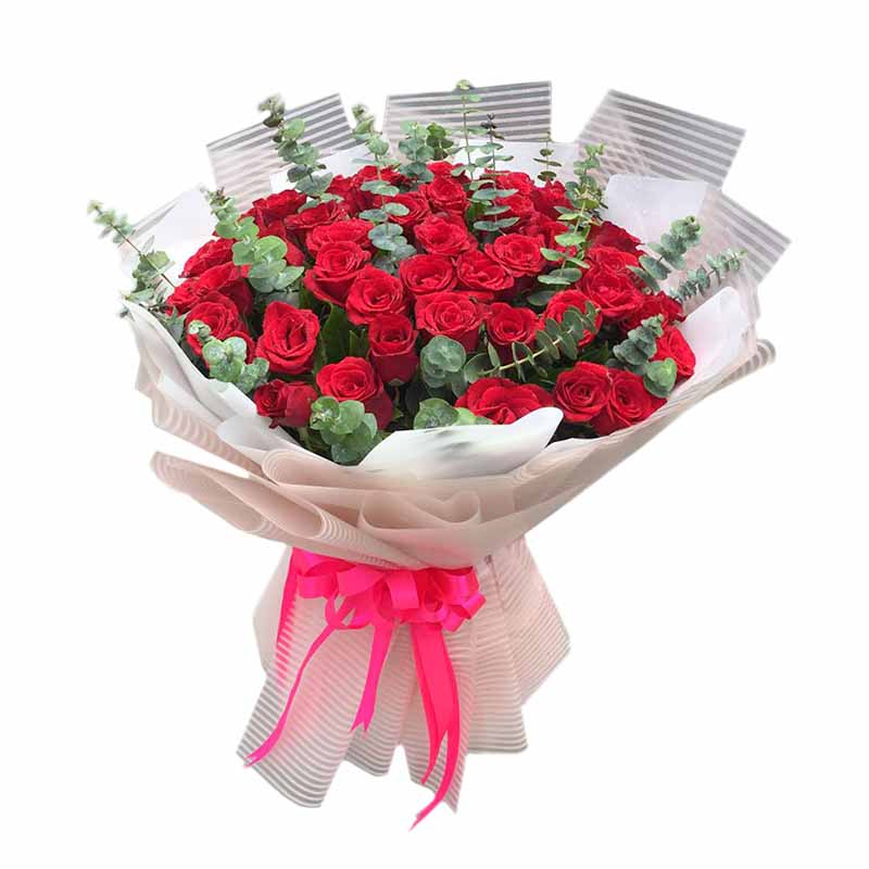 Striking bouquet of 60 passionate red roses with delicate eucalyptus fillers, presented in a Korean striped wrap and adorned with a satin ribbon. Elegant and sophisticated floral arrangement. Flower delivery in Bacoor.