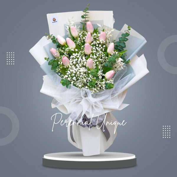 Gorgeous bouquet of one dozen pink tulips with gypsophila and eucalyptus fillers in tissue and Korean wrap with net - natural beauty and charm - flower delivery to Barangay Sun Valley, Parañaque City and Barangay Tambo, Parañaque City