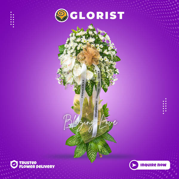 Serene funeral flower stand with Malaysian Mums, white anthurium accents, and Anahaw leaves. Conveys heartfelt sympathy and solace. Flower delivery in Pasay, Las Piñas, Rizal, and Tagaytay.