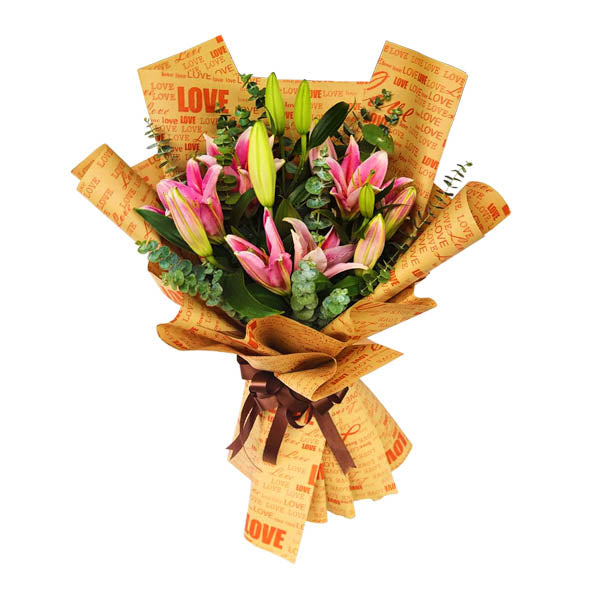 Elegant bouquet featuring three stunning stargazer lilies adorned with fresh eucalyptus leaves, presented in a chic Kraft paper wrap with a satin ribbon. Perfect for special occasions and gifts. Flower delivery in Calamba, Laguna.